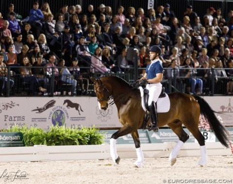 A sell-out crowd watches Benjamin Albright and Falstaff getting coached by Isabell Werth