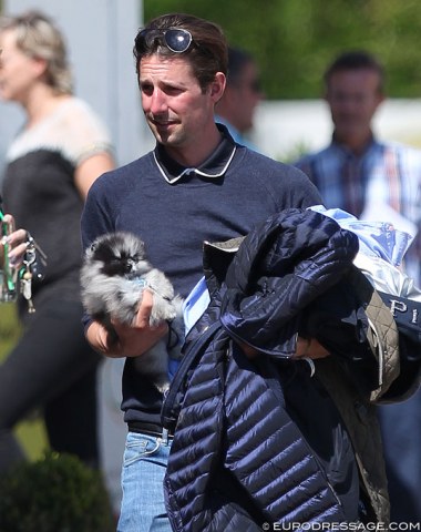 Qabil Ambak's and Danish youth team trainer Dennis Fisker with his brand new Pomeranian puppy