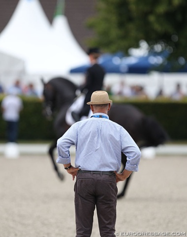 German assistant team trainer Jonny Hilberath overlooking Helen Langehanenberg's warm-up of Damsey