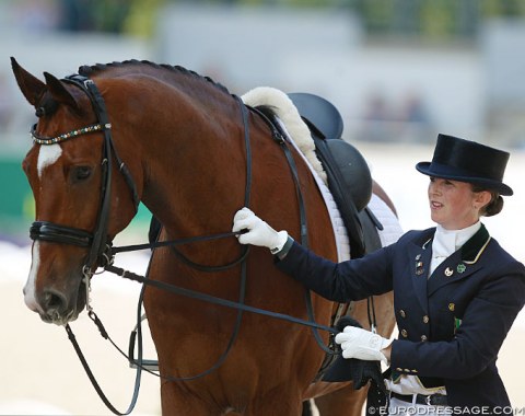 Judy Reynolds walked Leroy Naeldeborg out of the arena as he shook his head after the final halt and salute and his ear bonnet came off. 