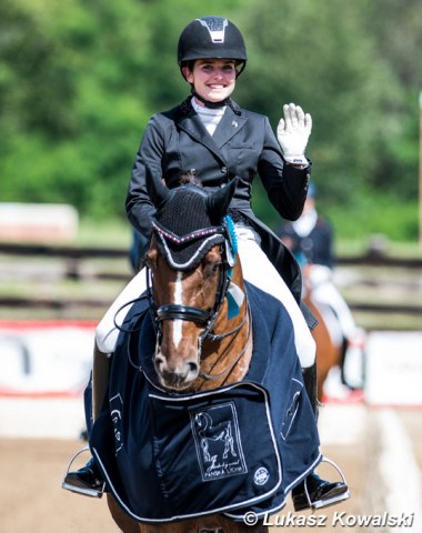 Rachel Bastady waves to the crowds in her lap of honour