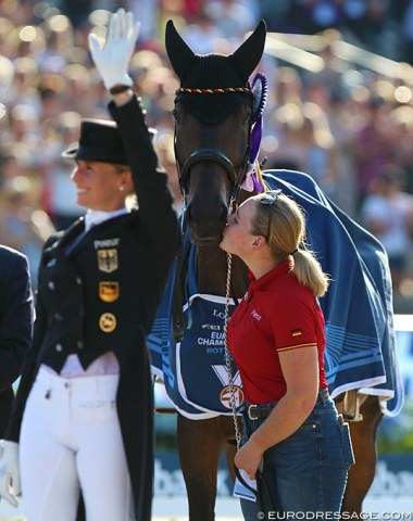 Dalera gets cuddles and kisses from groom Anna Liebing during the award ceremony