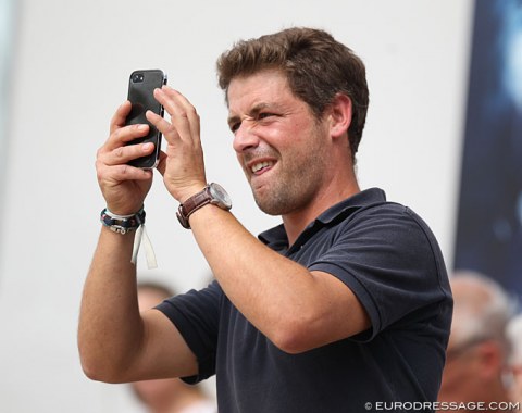 Husband Gregoire Naslin Nervously waiting for Larissa Pauluis' score to flash on the board