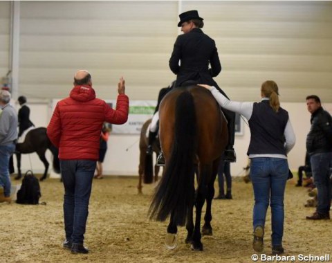 German assistant team trainer Jonny Hilberath talking to Dorothee Schneider after her test