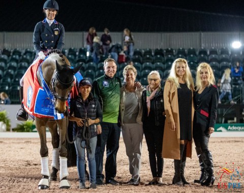 Olivia Lagoy-Weltz on Rassing's Lonoir, flanked by groom Nicole Ardito, sponsor Allyn Mann of Adequan®, judge Jane Weatherwax and USPRE officials Janne Rumbough, Kim Van Kampen and Jane Bistline