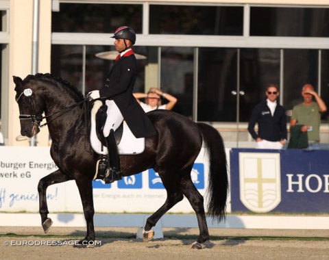 Dutch-Moroccan Yessin Rahmouni on the licensed breeding stallion All at Once; Patrik Kittel and Hans Peter Minderhoud watching him perform