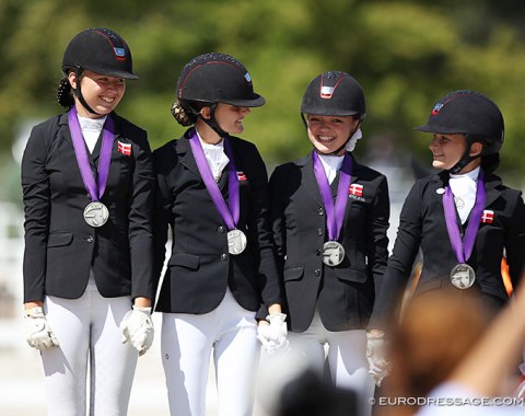 The silver medal winning Danish team (Nathalie Thomassen, Liva Addy Guldager Nielsen, Sophia Obel Jorgensen, Josephine Gert Nielsen) with big smiles at the award ceremony