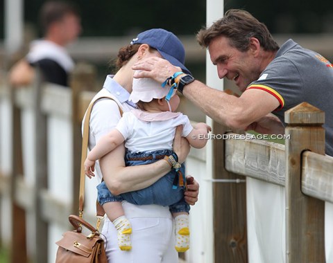 Spanish team trainer Rudolf Zeilinger cuddling his almost one-year old daughter Eleonore