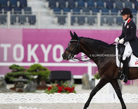 Canada's Lindsay Kellock leaving the Tokyo arena with Sebastien