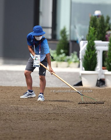 Dedicated volunteer excelling at raking the footing!