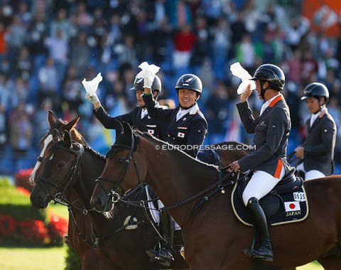 Japanese dressage riders Kazuki Sado and Shingo Hayashi join the Japanese show jumpers in the closing ceremony and parade of nations at the 2021 CDIO Aachen