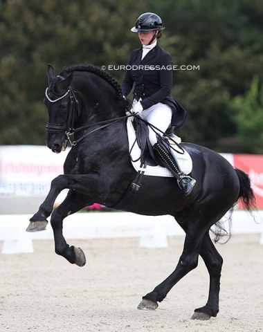 Russian Marina Aframeeva on Friesian Marcus