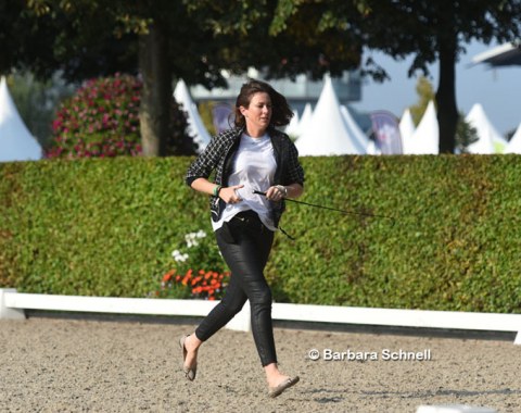 Lyndal Oatley helping husband Patrik Kittel as groom