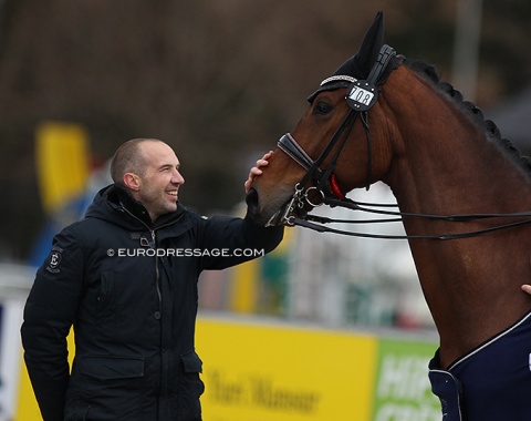 Wim Oosterlinck, who is part of the organisation team, pats Heavenly Charming in the prize giving