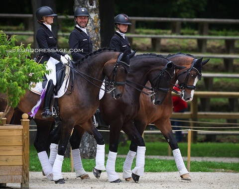 The third placed Belgian team entering the stadium: Fairchild, Michiels, Pauluis