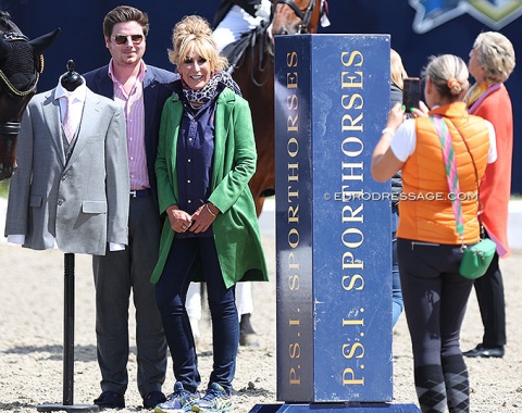 Dressage rider Christiane "Jany" Schuarte taking a photo of her son Christian and organizer Renate Dahmen with a Bespoke jacket that was gifted to the top ranked riders in the Grand Prix