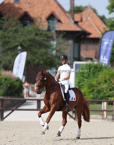 Alexandre Cheret warming up Doruto, the Haras stables in the background