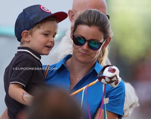 Henri Ruoste's son Nicolas Kirchhoff holding a cute stick horse/dog 