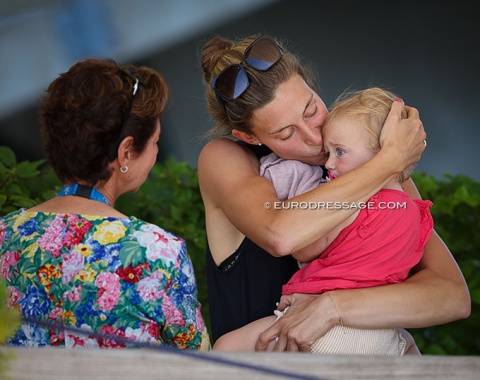 German Grand Prix rider Carina Scholz kissing daughter Elena