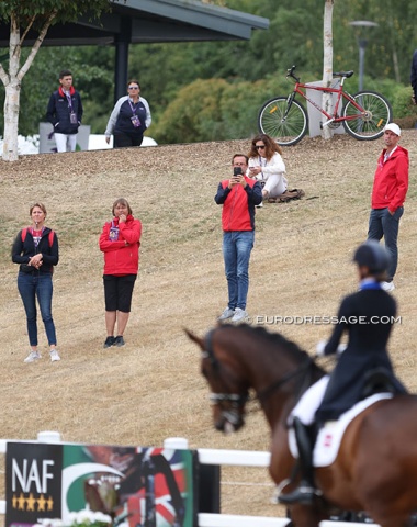 The Danish technical staff with team captain Janne Moller Thode and team trainer Dennis Fisker watching their riders compete
