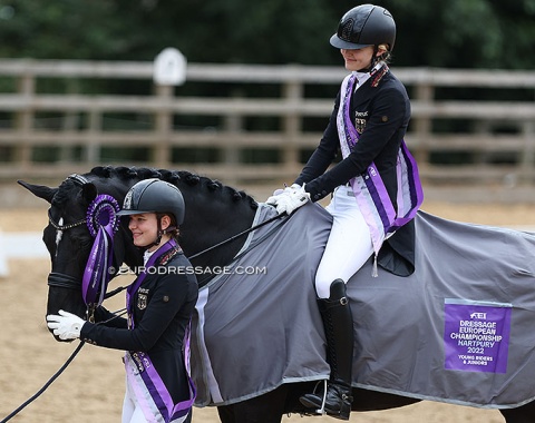 German team gold medal winning Helena Schmitz-Morkramer hugs her sister Allegra's Libertad, who won team gold in the junior division