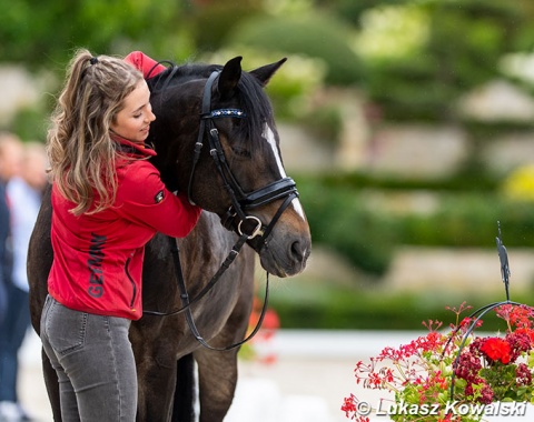 German young rider Jana Lang hugging her former pony Nur fur Dich