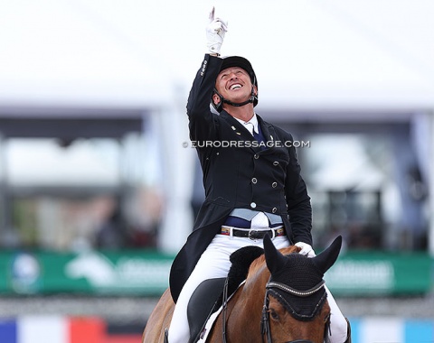 Julio Mendoza points to the sky after he heard he scored over 74%