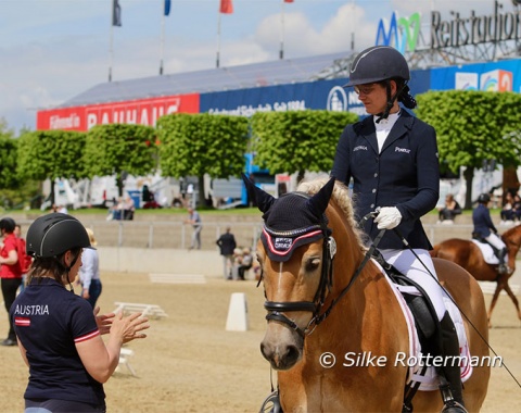 Austrian Grade 2 rider Michaela Ferringer gets last minute instructions from her trainer Manuela Rathner before her freestyle with the charming Haflinger Stockholm.