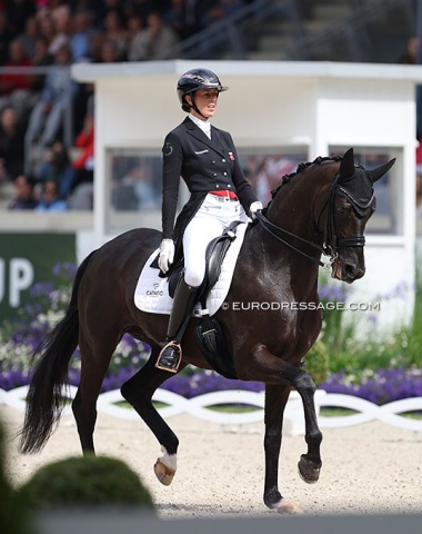 Carina Cassoe Kruth and Heiline's Danciera performed to the Backstreet Boys. Top passage and half passes, but mistakes in the ones and incorrect piaffes with crossing of the front and hind legs pushed the score down.