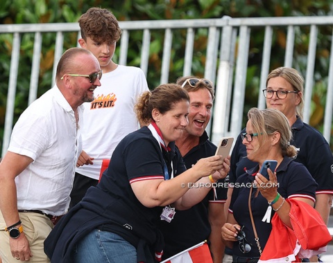 Austrian fans looking at the score website to see the results change to silver