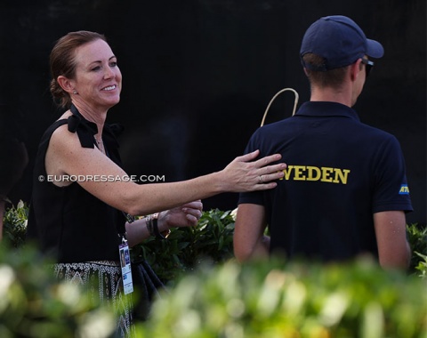 Lynda Oatley pats Dante Weltino's groom Sebastian Ulrich on the back