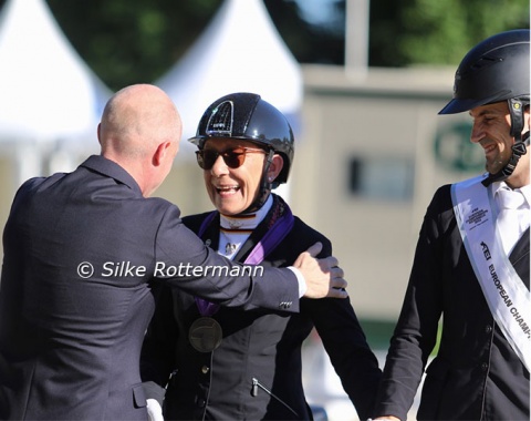 Ronan Murphy, FEI director dressage, congratulates an ecstatic Martina Benzinger to her silver medal