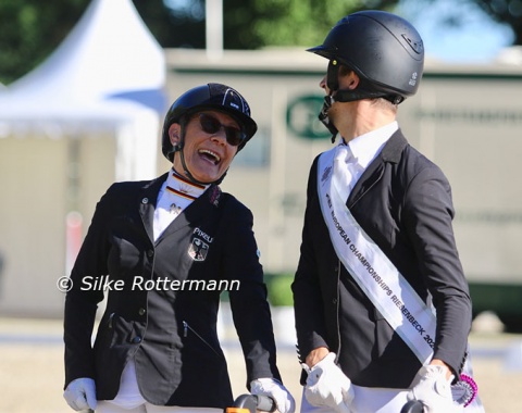 German silver medalist Martina Benzinger and the new European champion share a laugh on the podium