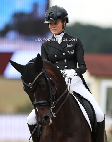 Australian Jemma Heran wears a patch on her tails which says "Dressage QLD Performance Squad 2019"