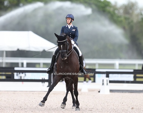 Early morning ride for Amy Bock and Walk the Line while the derby field in the back is getting watered