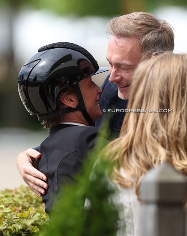 Isabell Werth's high calibre circle of friends. She gets a hug from German minister of finance, Christian Lindner, whose wife Franca Lehfeldt handles her social media account