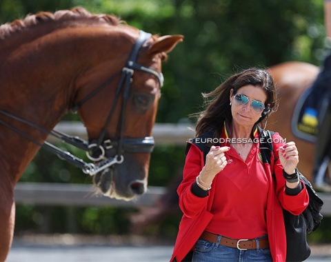 Belgian coach Carmen de Bondt training a pony and junior team rider. She'll be off to Paris to train two Belgian team members (De Winne, Michiels)