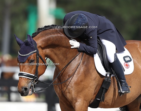 German Elisabeth Wagnerberger kisses Outlaw Pete, a Danish warmblood by Skovens Rafael x Coronado