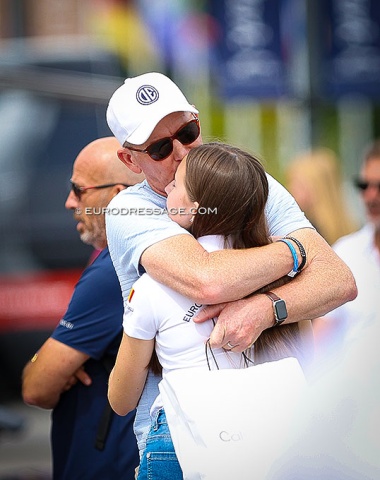 Gareth Hughes, former British Grand Prix team rider, hugging and kissing his daughter Ruby