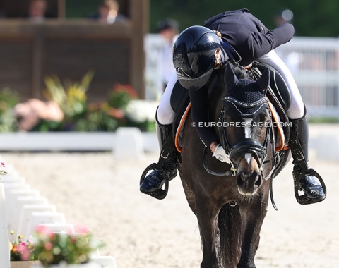 Britt Kikkert hugs her pony Nur Fur Dich