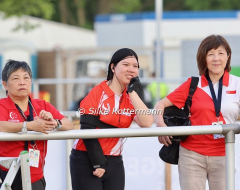 Singapore’s Grade 3 rider Hui’En Hilary Su watching her horse Gambler being warmed-up, before it is her turn.