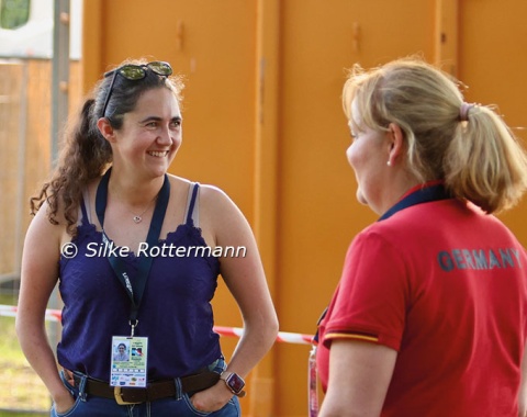 German Grade 2 rider Julia Porzelt shares a laugh with German national coach Silke Fütterer.