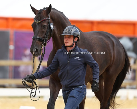 Trainer Adrian Roldan trots up Let's Go Crazy for his student Maria Badell Sanchez