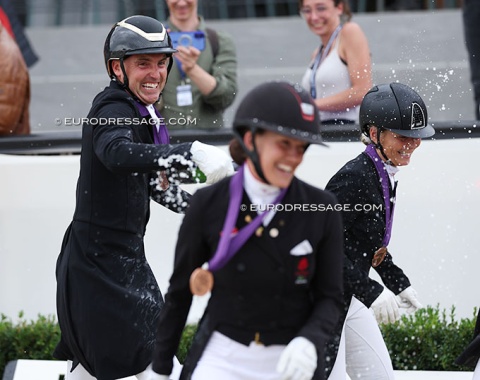 Helgstrand chasing Dufour and Dupont for a champagne shower