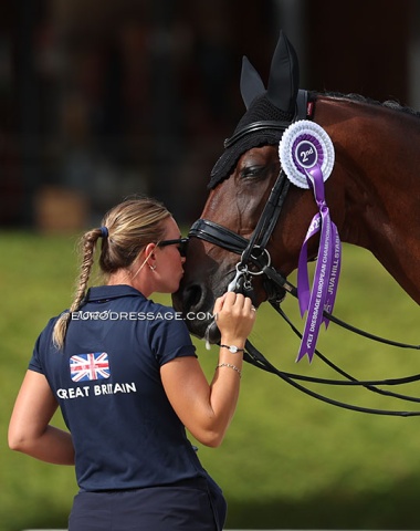Groom Lucy Scudamore kisses Fame
