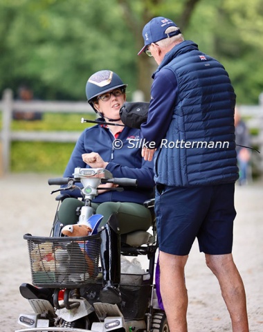 British Mari Durward-Akhurst talking to her father...