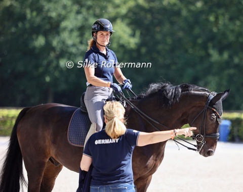 German team coach Silke Fütterer giving advice to Grade V rider Isabell Nowak and Siracusa OLD (by Sir Donnerhall-Blue Hors Don Schufro)