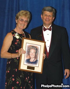 Jessica Ransehousen became an inductee into the USDF Hall of Fame. USDF president Sam Barrish presents the award :: Photo © Mary Phelps