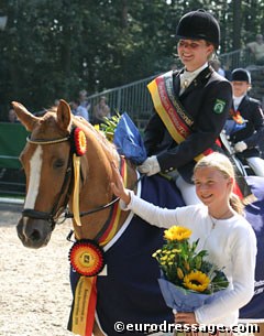 Helena Camp on her 2004 Bundeschampion Dornika. Owner Sanneke Rothenberger smiles
