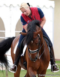 Fiona Bigwood gives her horse Mr G de Lully a big pat for doing a good job in the warm up ring.